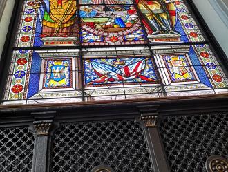 The stained glass window at the far end of the Council Chamber